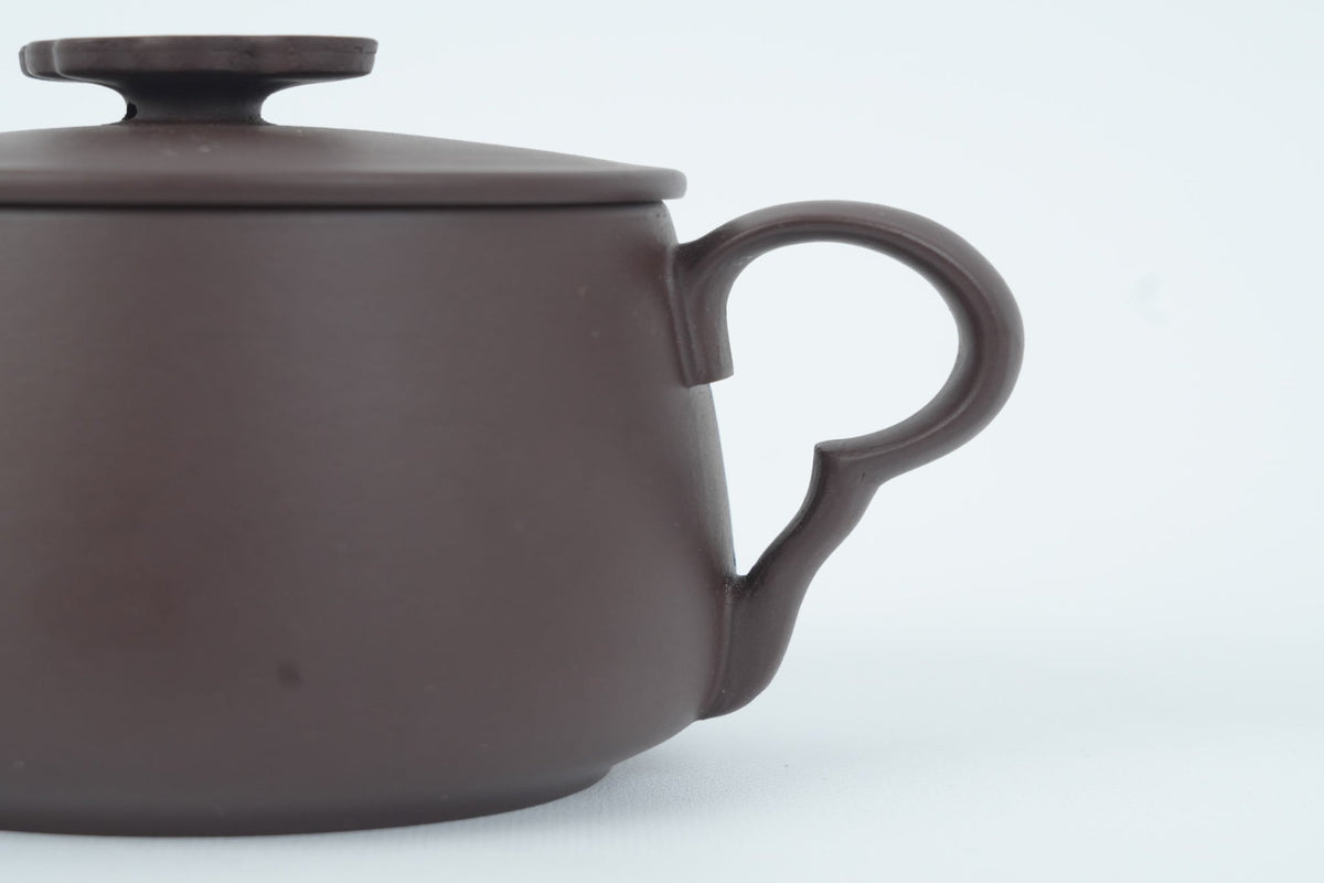 Close-up of the cloud-inspired handle on the Good Fortune Zisha Cup