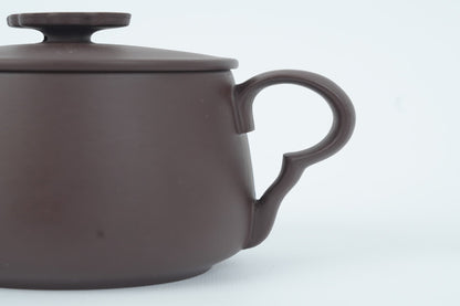 Close-up of the cloud-inspired handle on the Good Fortune Zisha Cup